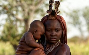 a person carrying a baby